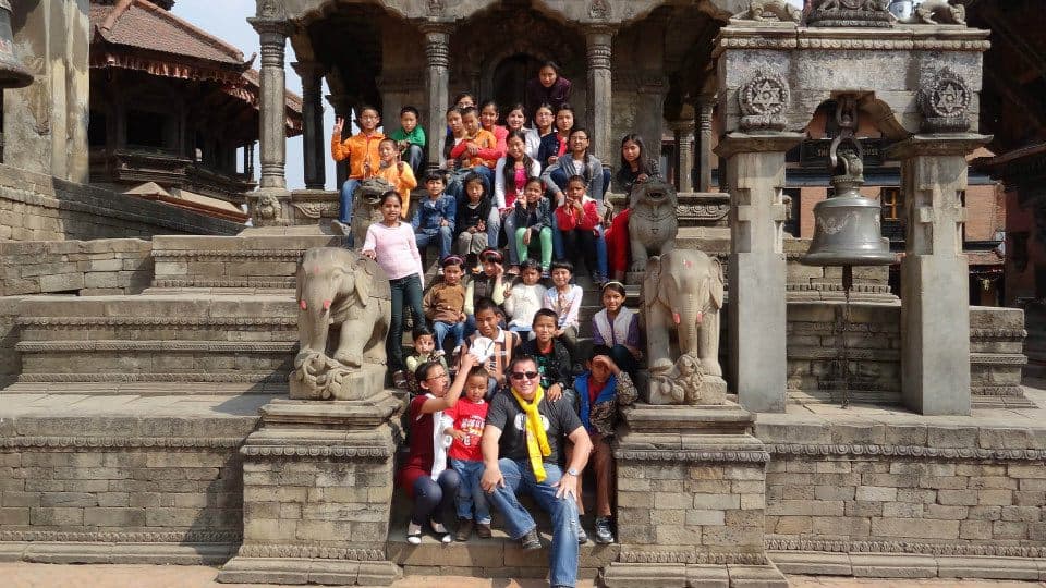 Children from the Center for Global Change programs in Nepal, on temple steps